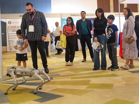 Parents and children explore the future of robotics at Gulf News Edufair Dubai 2025.