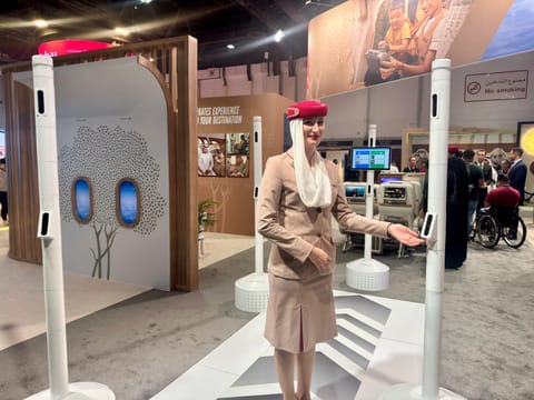 An Emirates cabin crew member showcases the upgraded Smart Tunnel camera feature at the AccessAbilities Expo.