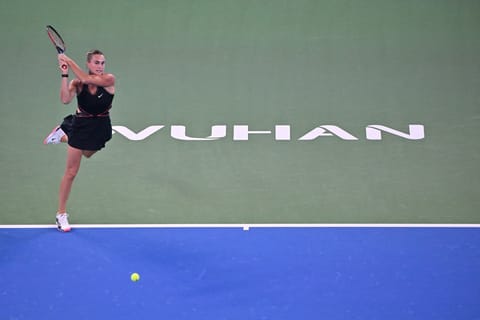 Belarus’ Aryna Sabalenka hits a return to Russia’s Liudmila Samsonova during their women’s singles match at the Wuhan Open tennis tournament in Wuhan, Central China’s Hubei province on October 9, 2025.