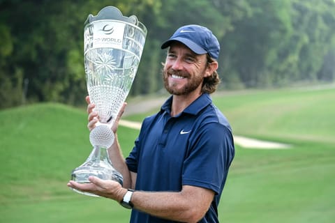 England's Tommy Fleetwood poses with the trophy after winning the DP World India Championship 2025 golf tournament at the Delhi Golf Club in New Delhi on October 19, 2025.