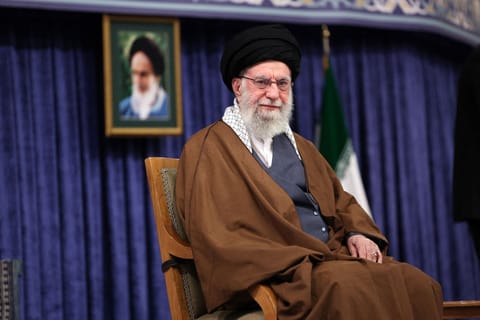A handout picture provided by the office of Iran's Supreme Leader Ayatollah Ali Khamenei shows him addressing a meeting with local champions and medalists of sports and world science awards in Tehran on October 20, 2025.