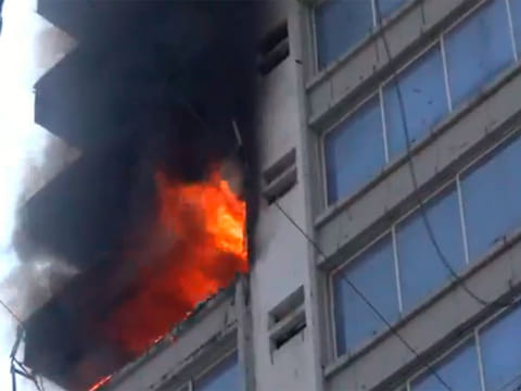 Visuals from the scene showed people stranded on the top floor of the commercial building as firefighters worked to rescue them.
