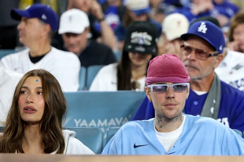 Justin Bieber and Hailey Bieber watch game three of the 2025 World Series on October 27, 2025 in Los Angeles, California.