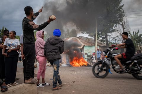 People protest in the streets of Arusha, Tanzania, on election day Wednesday, Oct. 29, 2025.