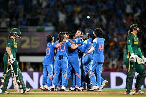 India's players celebrate after the dismissal of South Africa's Chloe Tryon during the ICC Women's Cricket World Cup 2025 one-day international (ODI) final match between India and South Africa at the DY Patil Stadium in Navi Mumbai on November 2, 2025.