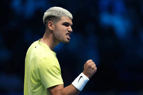 Spain's Carlos Alcaraz reacts after winning a point against Australia's Alex de Minaur during their singles tennis match of the ATP World Tour Finals, in Turin, Italy, Sunday, Nov. 9, 2025.