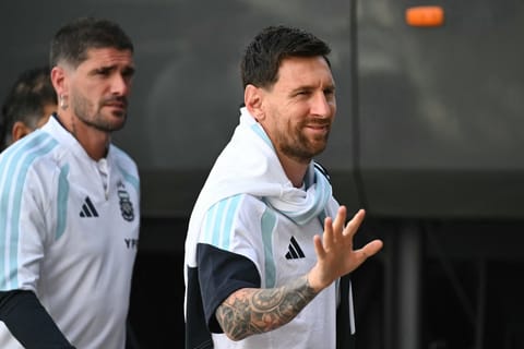 Argentina's forward Lionel Messi waves as he arrives at a training session at Martinez Valero Stadium in Elche, Spain on November 13, 2025, on the eve of their friendly football match against Angola to be held in Luanda.