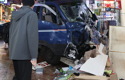 A truck crashes at a market in Bucheon, South Korea, Thursday, Nov. 13, 2025.