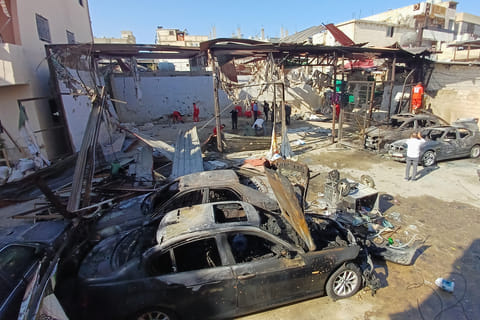Palestinian rescue workers check the scene where an Israeli strike on Tuesday night hit the Ein el-Hilweh Palestinian refugee camp, in the southern port city of Sidon, Lebanon, Wednesday, November 19, 2025.