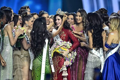 Miss Mexico Fatima Bosch (C) is surrounded by contestants as she celebrates winning the 2025 Miss Universe pageant in Nonthaburi, north of Bangkok, on November 21, 2025.