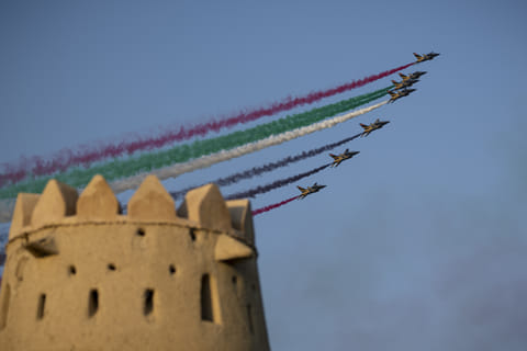 Pictured above is a spectacular air display at the celebration for 181 grooms from the Al Ain region at Al Jahili Fort.