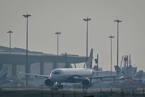 An IndiGo Airlines aircraft prepares to take off at Kempegowda International Airport on a hazy day in Bengaluru on December 9, 2025.