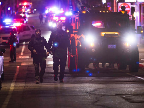 Police officers remain on the scene of a shooting that killed two and wounded at least eight at Brown University on December 13, 2025 in Providence, Rhode Island.