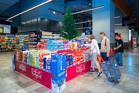 Shoppers browse festive cakes and Christmas décor at a UAE supermarket ahead of Christmas.