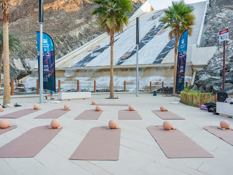 Visitors embraced wellbeing activities in stunning outdoor settings.