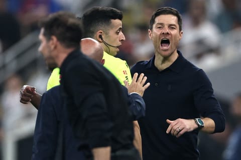 Real Madrid's Spanish coach Xabi Alonso shouts at Atletico Madrid's Argentine coach Diego Simeone during the Spanish Supercup semi-final football match between Atletico Madrid and Real Madrid at King Abdullah Sports City in Jeddah on January 8, 2026.