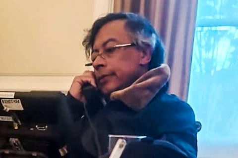 Handout video grab provided by Colombia's presidency press office showing Colombia's President Gustavo Petro talking on the phone with his US counterpart Donald Trump, at Narino Palace in Bogota on January 7, 2026.