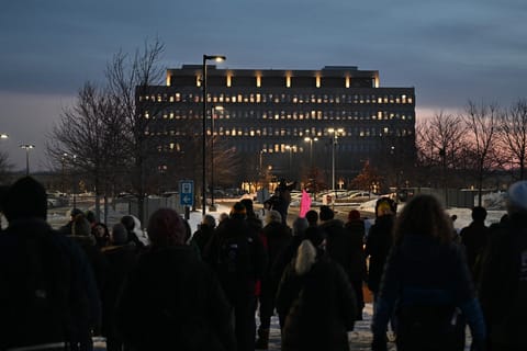 Protesters gather outside the Bishop Henry Whipple Federal Building, Thursday, Jan. 8, 2026, in Minneapolis, Minn.