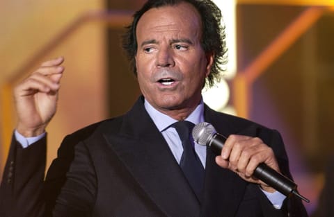 Spanish singer Julio Iglesias sings during the Telethon television program in Paris on December 6, 2003.