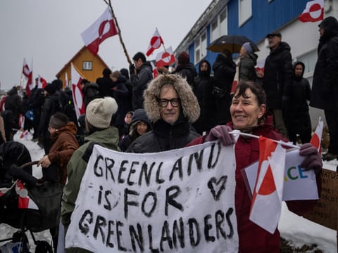 People in Greenland attend a protest against US President Donald Trump.