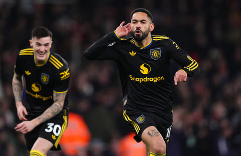 Manchester United's Matheus Cunha celebrates scoring their side's third goal of the game during the English Premier League soccer match between Arsenal and Manchester United in London