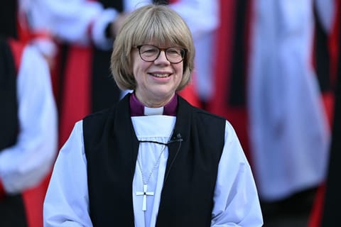 The new Archbishop of Canterbury Sarah Mullally smiles on the steps of St Paul’s Cathedral after taking part in a 'Confirmation of Election' ceremony in London on January 28, 2026.