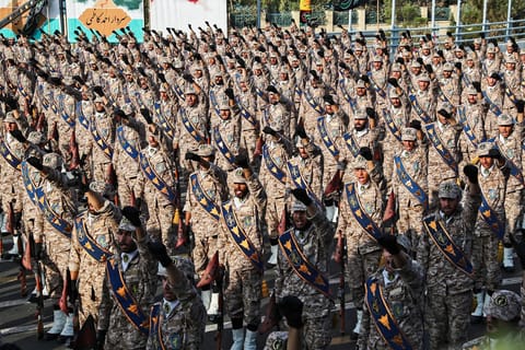 This handout file picture provided by the Iranian presidency on September 22, 2019 shows members of Iran's Islamic Revolutionary Guard Corps (IRGC) giving a military salute during a military parade in Tehran.