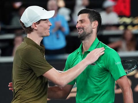 Novak Djokovic, right, of Serbia is congratulated by Jannik Sinner, left, of Italy following their semifinal match at the Australian Open tennis championship in Melbourne, Australia, on Saturday, January 31, 2026.