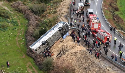 This handout photograph taken and released on February 1, 2026 by Turkish news agency DHA shows an aerial view of a Bus accident where first aid official work in Antalya.