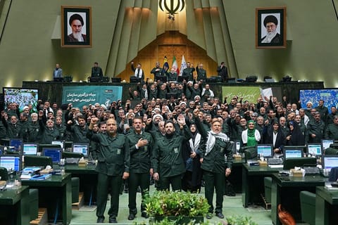Members of Iran's parliament dressed in IRGC uniforms, chant "Death to America" during a session in Tehran on February 1, 2026,
