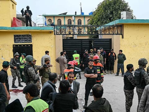 Security personnel stand guard outside a mosque following an explosion, in Islamabad on February 6, 2026.