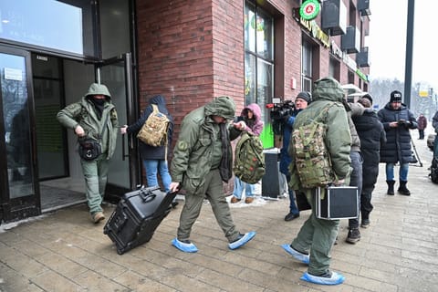 Investigators leave a high-rise residential building, the scene of an assassination attempt on Russian Lieutenant General Vladimir Alekseyev, in Moscow on February 6, 2026.