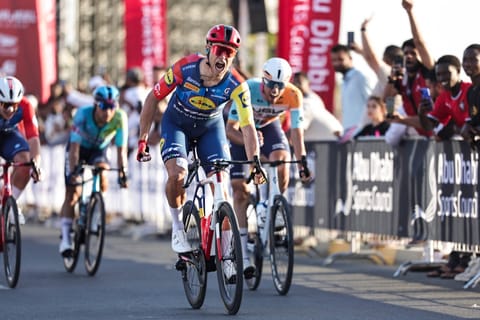 Jonathan Lidl-Trek's Italian rider Jonathan Milan reacts after crossing the finish line first during the fourth stage of the UAE Tour cycling event in al-Fujairah on February 19, 2026.