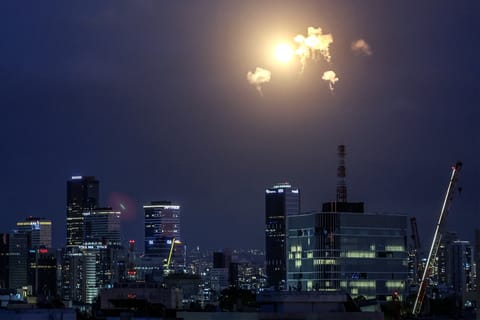 Explosions from projectile interceptions by Israel's Iron Dome missile defence system are pictured over Tel Aviv on February 28, 2026.