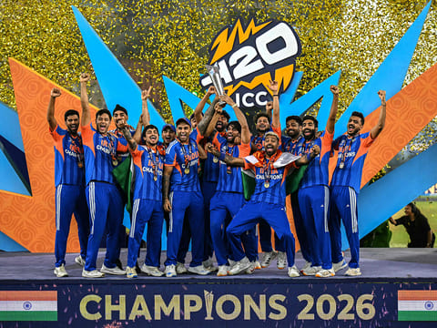 India's players celebrate with the trophy after winning the 2026 ICC Men's T20 Cricket World Cup final match against New Zealand at the Narendra Modi Stadium in Ahmedabad on March 8, 2026.