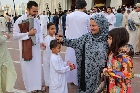 Kids distributing chocolates after Eid-Al-Fitr prayer at Al Noor mosque in Sharjah. Photo: Virendra Saklani/Gulf News