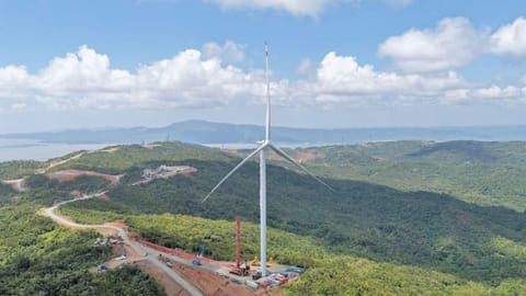 The first of 17 typhoon-resistant wind turbines rises in Laguna, southeast of Manila. It forms part of purpose-built "Kalayaan 2" project designed to withstand strong tropical storms coming in from the Pacific.