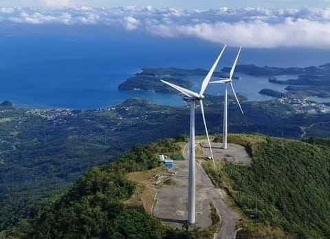 Wind wind turbines in Mindoro are paired with a Battery Energy Storage System (BESS) to smooth out generation fluctuations and ensure stable grid delivery.