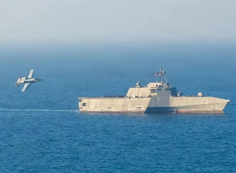 The Littoral Combat Ship (LCS) USS Santa Barbara is in the Arabian Gulf conducting mine countermeasures with unmanned surface vehicles. While hunting mines, she's operating under armed overwatch from A-10C Warthogs loaded with JDAMs, laser-guided APKWS rockets, and enough firepower to shred any fast boat or drone swarm the Islamic Regime throws at them.