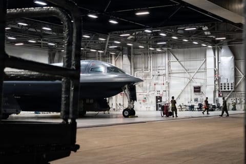 In this US Air Force handout photo released by US Central Command public affairs, US Airmen conduct preflight operations prior to a B-2 Spirit stealth bomber departing base in the US Strategic Command area of responsibility in support of Operation Epic Fury on March 29, 2026.
