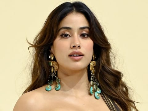 Bollywood actress Janhvi Kapoor poses for photographs during an event celebrating the Swadesh flagship store in Mumbai on December 5, 2025.