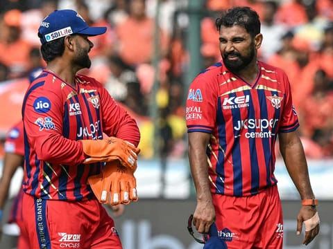 Lucknow Super Giants' Mohammed Shami (R) speaks with his captain Rishabh Pant during the IPL 2026 match againsit Sunrisers Hyderabad at the Rajiv Gandhi International Stadium in Hyderabad on April 5, 2026.