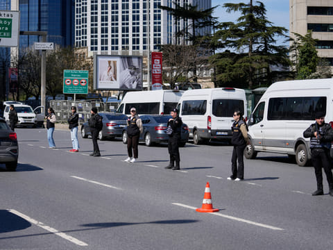 Turkish police secure the area after a gunmen attack at a building housing the Israeli Consulate in Istanbul, Turkey, Tuesday, April 7, 2026.