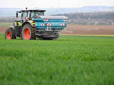 A farmer carries out the centrifugal spreading of ammonium nitrate on a field in Angevillers, northeastern France on April 10, 2026.