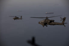 AH-64 Apaches fly above the Strait of Hormuz during a patrol on April 17, 2026. One of the most consequential dimensions of the conflict has received far less sustained attention, the environmental and climate-security impact of war.