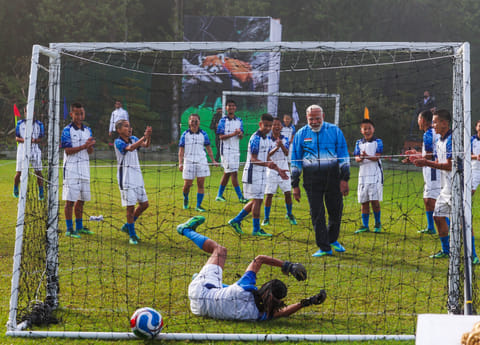 Prime Minister Narendra Modi plays football with youngsters, in Gangtok on Tuesday.