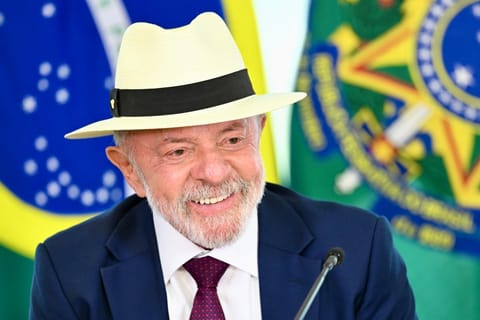 Brazil's President Luiz Inacio Lula da Silva smiles during the signing of the decree enacting the Trade Agreement between the European Union and Mercosur at the Planalto Palace in Brasilia on April 28, 2026.