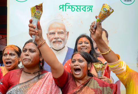 BJP workers celebrate the party's lead during the counting of votes for the West Bengal Assembly elections in Kolkata on Monday, May 4, 2026.
