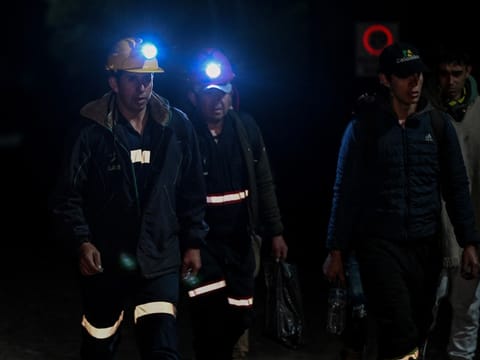 Miners walk around the site of an explosion at a coal mine in Sutatausa, Cundinamarca department, Colombia on May 4, 2026.