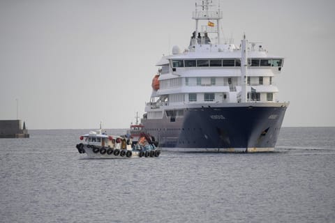 US passengers from the Dutch flagged hantavirus-stricken cruise ship MV Hondius are transferred by boat to the industrial port of Granadilla de Abona on the island of Tenerife in Spain's Canary Islands on May 10, 2026.